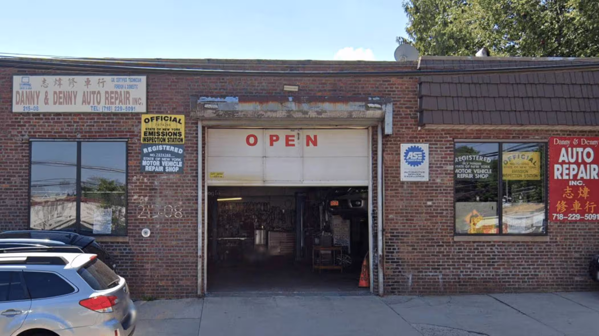 Danny & Denny Auto Repair storefront and garage bays in Bayside