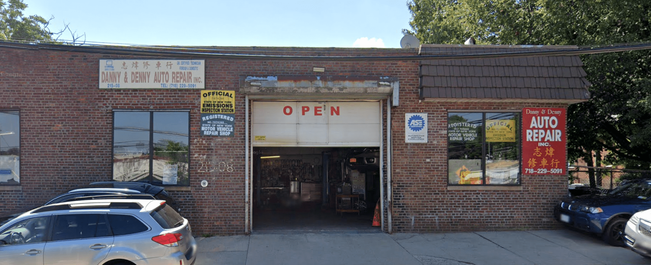 picture of storefront. garage door is open.